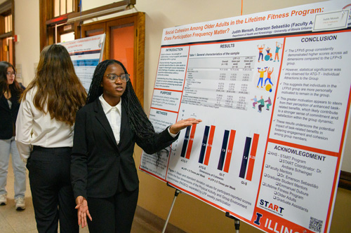 Student presenting a poster.